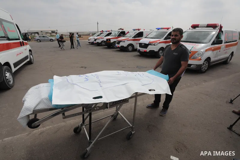 Palestinian ambulance drivers take part in a protest are called upon to pressure the Israeli to allow the free movement of patients through the Beit Hanoun checkpoint in front of the Erez Crossing in Beit Hanoun in the n...