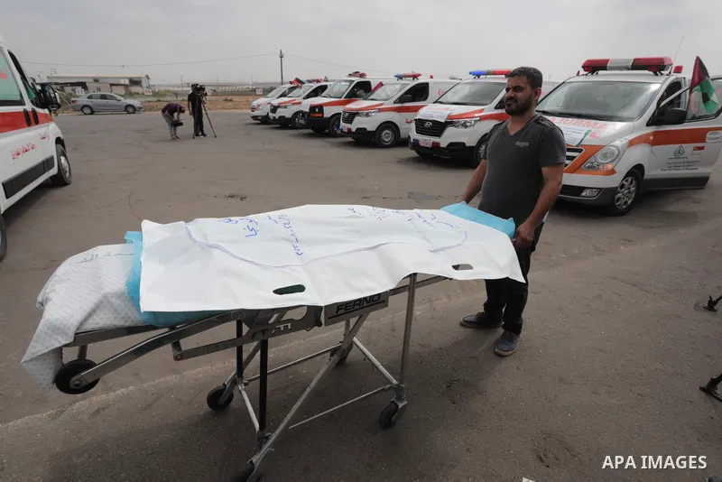 Palestinian ambulance drivers take part in a protest are called upon to pressure the Israeli to allow the free movement of patients through the Beit Hanoun checkpoint in front of the Erez Crossing in Beit Hanoun in the n...
