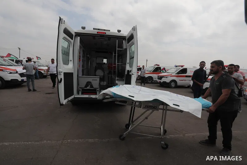 Palestinian ambulance drivers take part in a protest are called upon to pressure the Israeli to allow the free movement of patients through the Beit Hanoun checkpoint in front of the Erez Crossing in Beit Hanoun in the n...