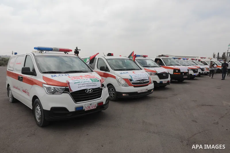 Palestinian ambulance drivers take part in a protest are called upon to pressure the Israeli to allow the free movement of patients through the Beit Hanoun checkpoint in front of the Erez Crossing in Beit Hanoun in the n...