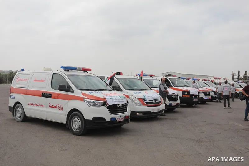 Palestinian ambulance drivers take part in a protest are called upon to pressure the Israeli to allow the free movement of patients through the Beit Hanoun checkpoint in front of the Erez Crossing in Beit Hanoun in the n...