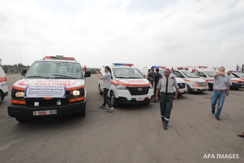 Palestinian ambulance drivers take part in a protest are called upon to pressure the Israeli to allow the free movement of patients through the Beit Hanoun checkpoint in front of the Erez Crossing in Beit Hanoun in the n...