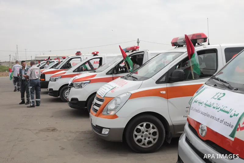 Palestinian ambulance drivers take part in a protest are called upon to pressure the Israeli to allow the free movement of patients through the Beit Hanoun checkpoint in front of the Erez Crossing in Beit Hanoun in the n...