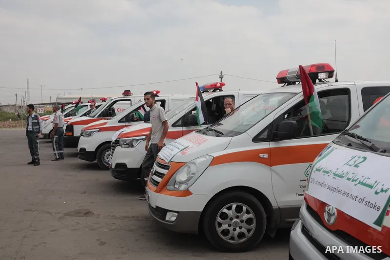 Palestinian ambulance drivers take part in a protest are called upon to pressure the Israeli to allow the free movement of patients through the Beit Hanoun checkpoint in front of the Erez Crossing in Beit Hanoun in the n...