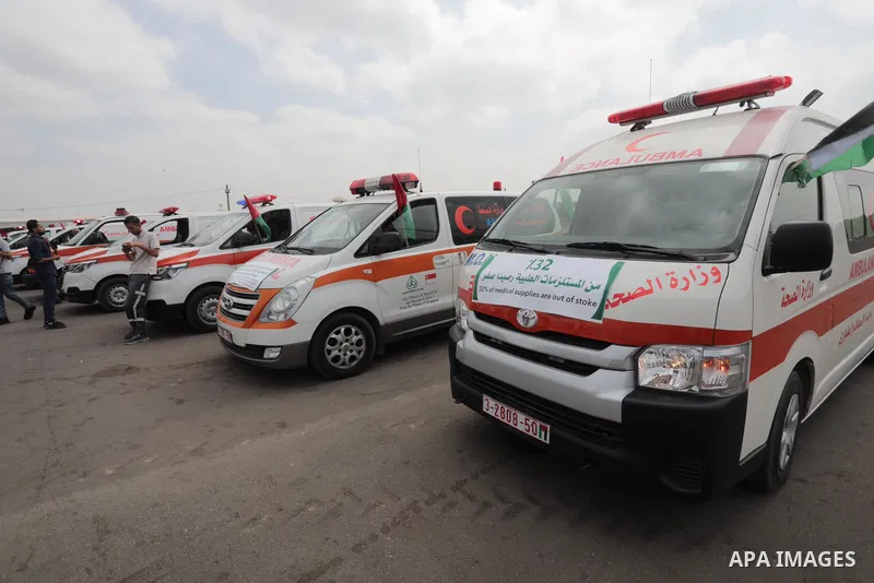 Palestinian ambulance drivers take part in a protest are called upon to pressure the Israeli to allow the free movement of patients through the Beit Hanoun checkpoint in front of the Erez Crossing in Beit Hanoun in the n...