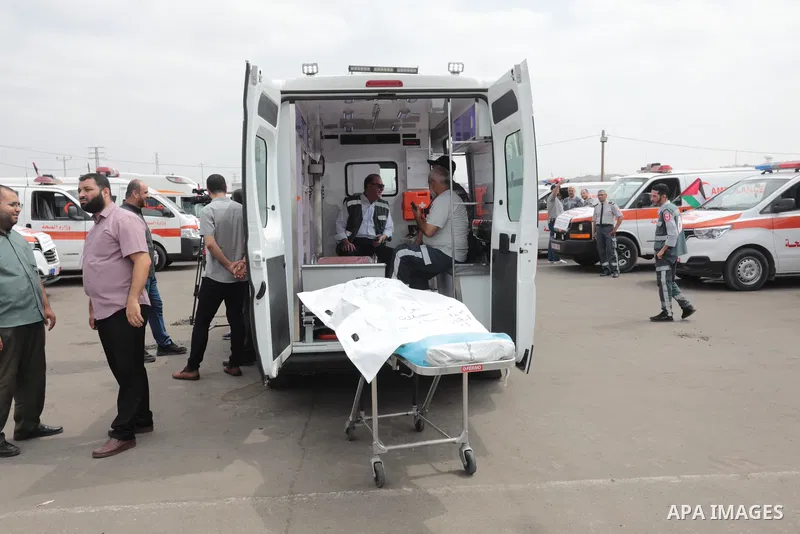 Palestinian ambulance drivers take part in a protest are called upon to pressure the Israeli to allow the free movement of patients through the Beit Hanoun checkpoint in front of the Erez Crossing in Beit Hanoun in the n...
