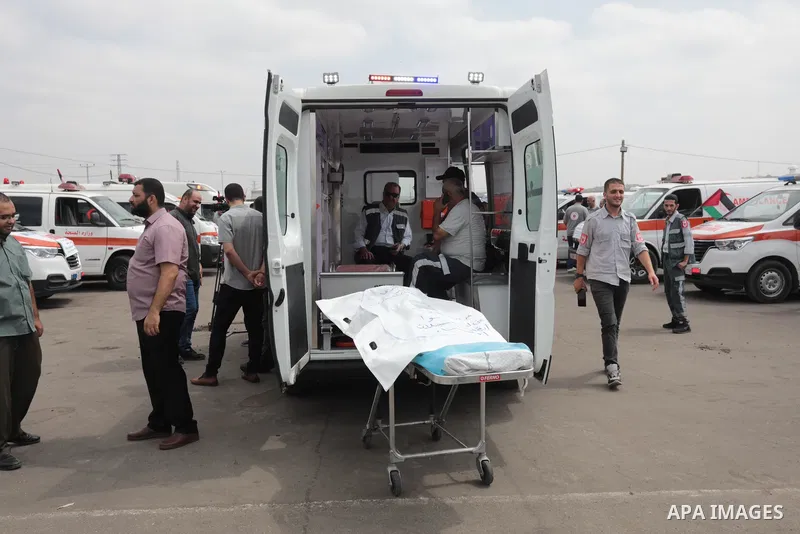 Palestinian ambulance drivers take part in a protest are called upon to pressure the Israeli to allow the free movement of patients through the Beit Hanoun checkpoint in front of the Erez Crossing in Beit Hanoun in the n...