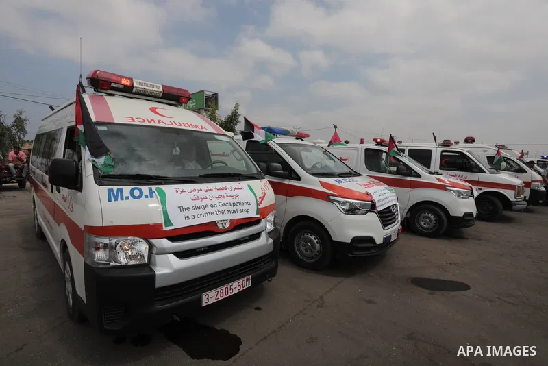 Palestinian ambulance drivers take part in a protest are called upon to pressure the Israeli to allow the free movement of patients through the Beit Hanoun checkpoint in front of the Erez Crossing in Beit Hanoun in the n...