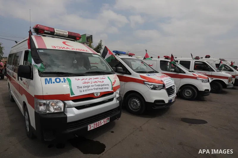 Palestinian ambulance drivers take part in a protest are called upon to pressure the Israeli to allow the free movement of patients through the Beit Hanoun checkpoint in front of the Erez Crossing in Beit Hanoun in the n...