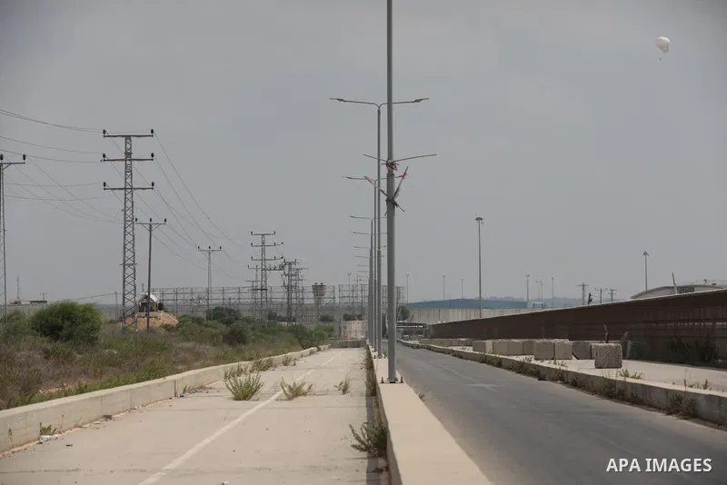 Palestinian ambulance drivers take part in a protest are called upon to pressure the Israeli to allow the free movement of patients through the Beit Hanoun checkpoint in front of the Erez Crossing in Beit Hanoun in the n...