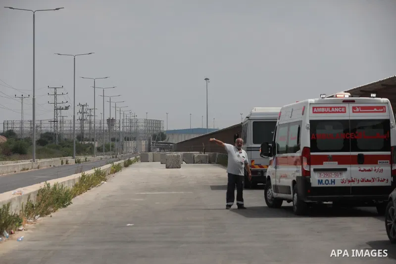 Palestinian ambulance drivers take part in a protest are called upon to pressure the Israeli to allow the free movement of patients through the Beit Hanoun checkpoint in front of the Erez Crossing in Beit Hanoun in the n...