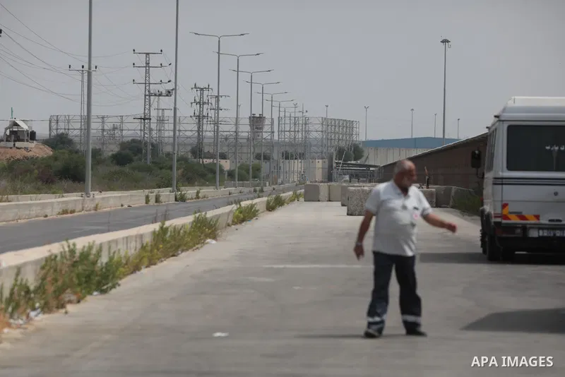 Palestinian ambulance drivers take part in a protest are called upon to pressure the Israeli to allow the free movement of patients through the Beit Hanoun checkpoint in front of the Erez Crossing in Beit Hanoun in the n...