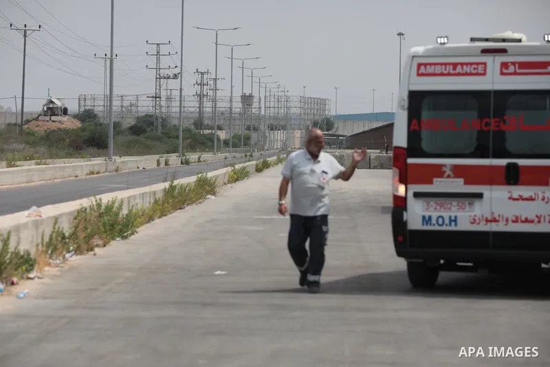 Palestinian ambulance drivers take part in a protest are called upon to pressure the Israeli to allow the free movement of patients through the Beit Hanoun checkpoint in front of the Erez Crossing in Beit Hanoun in the n...