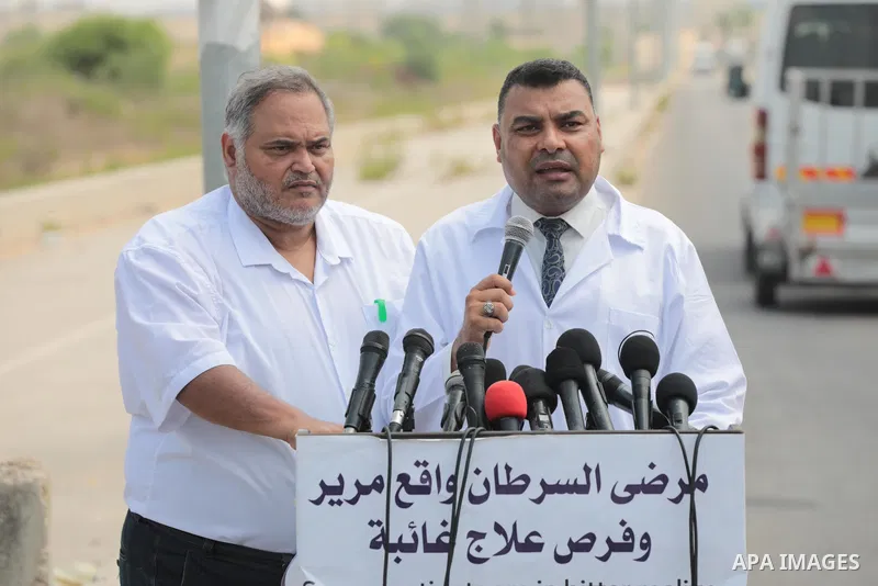 A spokesman for the Palestinian Ministry of Health, Ashraf Al-Qudra speaks during a protest are called upon to pressure the Israeli to allow the free movement of patients through the Beit Hanoun checkpoint in front of th...