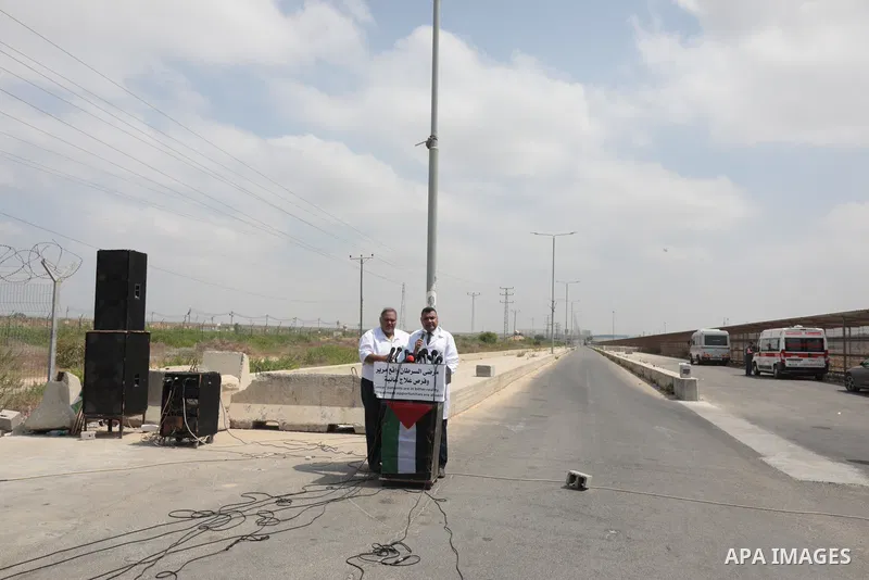 Palestinian ambulance drivers take part in a protest are called upon to pressure the Israeli to allow the free movement of patients through the Beit Hanoun checkpoint in front of the Erez Crossing in Beit Hanoun in the n...