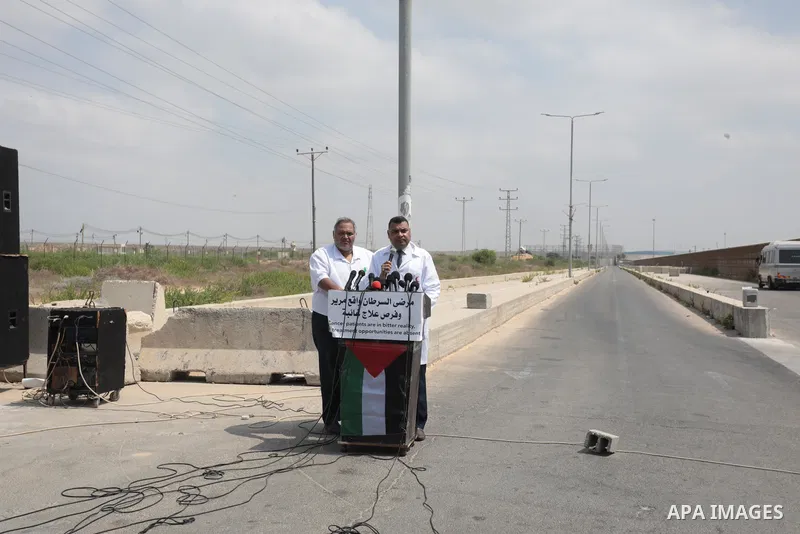 Palestinian ambulance drivers take part in a protest are called upon to pressure the Israeli to allow the free movement of patients through the Beit Hanoun checkpoint in front of the Erez Crossing in Beit Hanoun in the n...