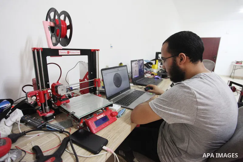 Palestinian engineer Mohammad Abu Matar, 35, uses 3D printing to produce the medical and educational equipment at a laboratory in Gaza City on August 31, 2022. Abu Matar, a specialist in digital manufacturing and 3D prin...