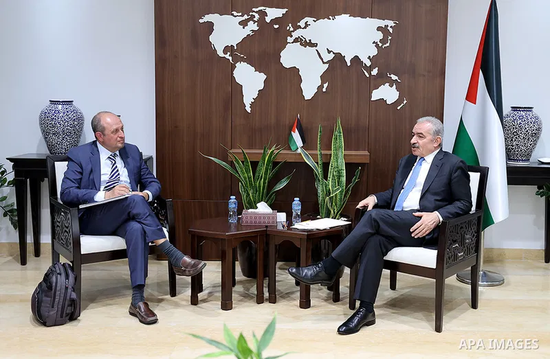 Palestinian Prime Minister Mohammad Shtayyeh meets with US envoy Hadi Amro, in the West Bank city of Ramallah on August 31, 2022. Photo by Ahmed Attari\ apaimages