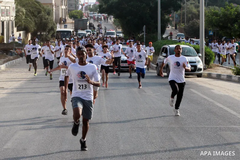 Palestinian runners participate in the Freedom Marathon on the occasion of Malaysian National Day, in Gaza city on August 31, 2022. Malaysia's Independence Day is celebrated on August 31st. Also known as Merdeka Day (Fre...