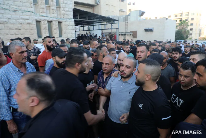 Smoke rises from a home of Palestinian Mohammad Al-Azizi during an Israeli military operation in the West Bank city of Nablus on July 24, 2022. Israeli troops killed Two Palestinian civilian in the West Bank, the Palesti...