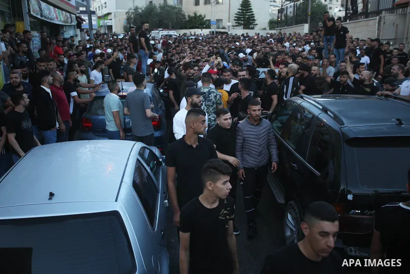 Relatives of Palestinians Mohammad Al-Azizi and Abboud Sobh, who were killed by Israeli forces, mourn during their funeral in the West Bank city of Nablus on July 24, 2022. Israeli troops killed Two Palestinian civilian...
