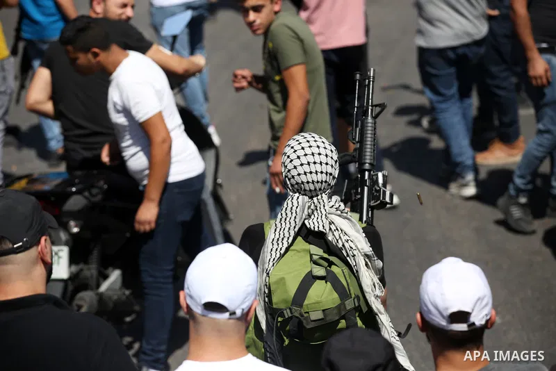 Mourners carry the bodies of two Palestinians who were killed by Israeli forces, during their funeral, in the West Bank city of Nablus on July 24, 2022. Two Palestinians were shot dead last night and ten others wounded,...