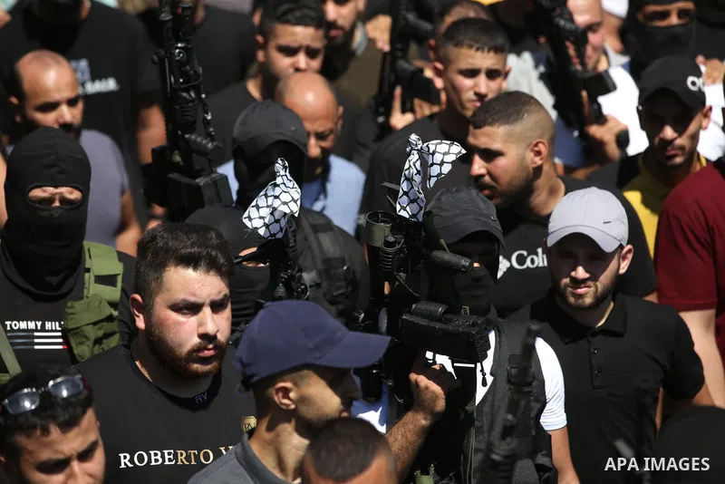 Mourners carry the bodies of two Palestinians who were killed by Israeli forces, during their funeral, in the West Bank city of Nablus on July 24, 2022. Two Palestinians were shot dead last night and ten others wounded,...