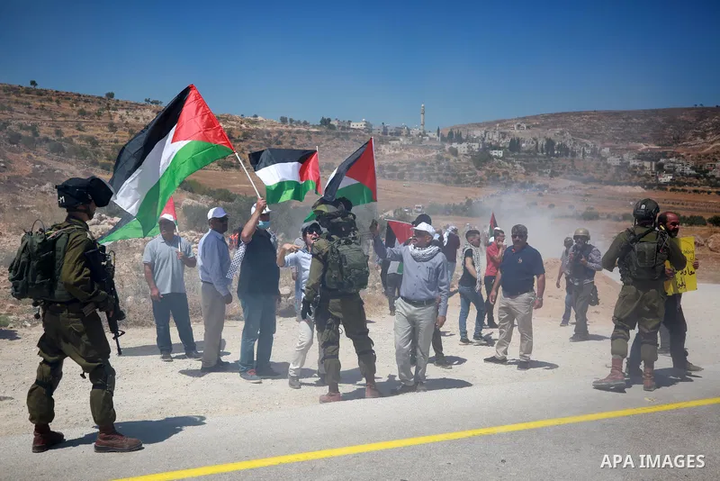 Palestinian protesters clash with Israeli forces during a demonstration against settlement expansion, in the village of al-Mughayer, east of Ramallah in the West Bank, on July 29, 2022. Photo by Stringer