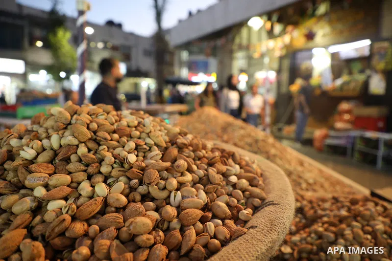 Palestinians shop at a market ahead of the Muslim festival of sacrifice Eid al-Adha, in the West Bank city of Ramallah on July 7, 2022. Eid al-Adha, or the feast of sacrifice, falls at this month when Muslims will slaugh...