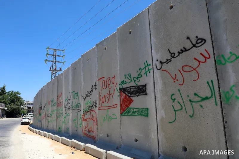 A picture taken on July 18, 2022 shows a new section of Israel's controversial separation barrier built by Israeli authorities around Beit El settlement at the northern entrance to the city of Ramallah in the West Bank....