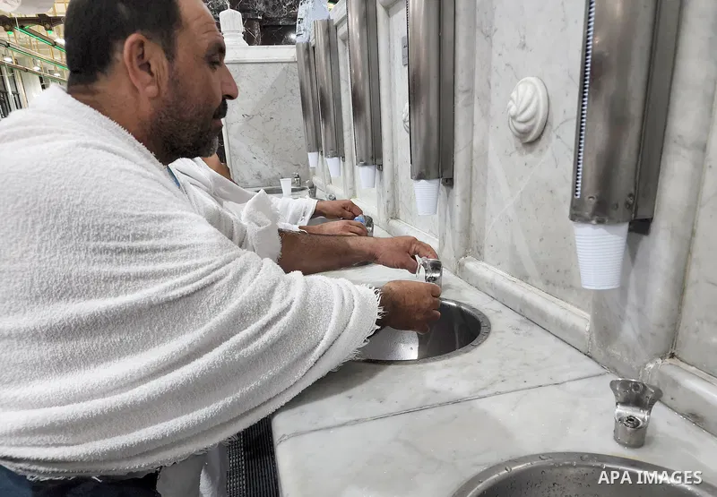 Palestinian Muslims pilgrims drink Zamzam water during the annual hajj pilgrimage, in Mecca, Saudi Arabia, on July 02, 2022. Annual Saudi Arabia welcomed its first batch of hajj pilgrims since before the coronavirus pand...