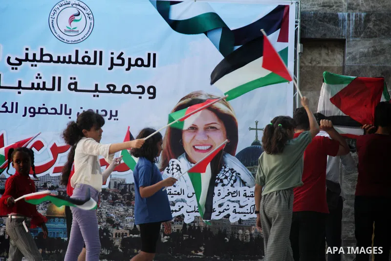 Palestinians attend an artistic operetta in memory of Al Jazeera journalist Shireen Abu Akleh, in Gaza city on July 5, 2022. Al Jazeera journalist Shireen Abu Akleh was likely to have been killed by gunfire from Israeli...