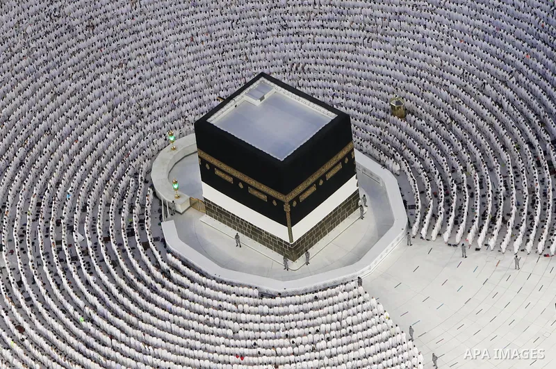 Muslim worshippers are seen pray around the Kaaba at the Grand Mosque from the Abraj Al-Bait Towers also known as the Mecca Royal Hotel Clock Tower, in Saudi Arabia's holy city of Mecca, on July 6, 2022. One million peop...