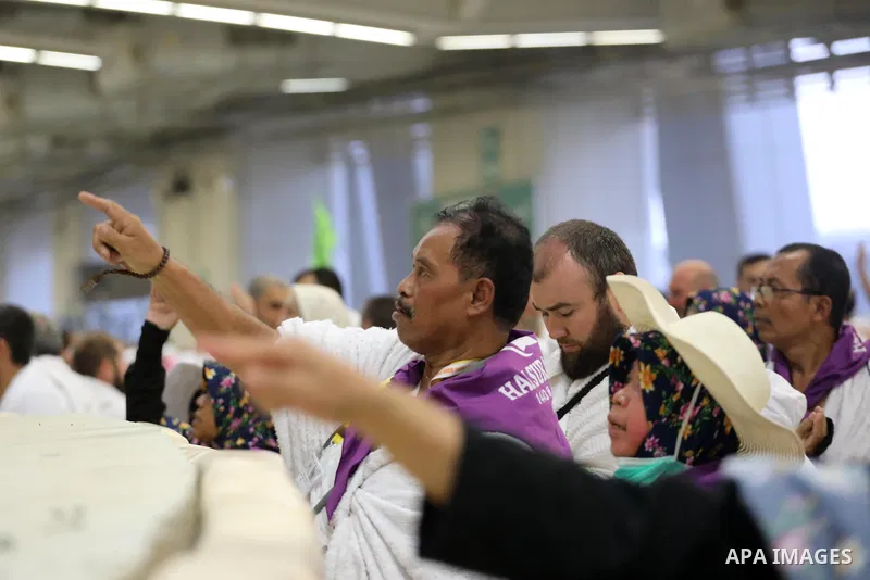 Muslim worshippers cast stones as part of a symbolic stoning of the devil ritual, during the Hajj pilgrimage in Mina, near Saudi Arabia's holy city of Mecca on July 09, 2022. From first light, small groups of pilgrims ma...