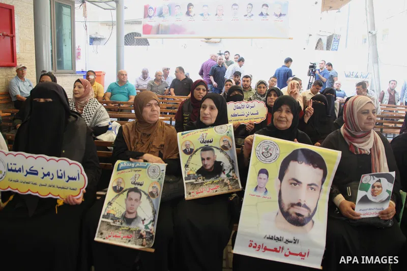 Palestinians take part in a protest to show solidarity with prisoners held in Israeli jails, in front of Red cross office in Gaza city, on July 18, 2022. According to the latest figures from Addameer, the Palestinian Pri...