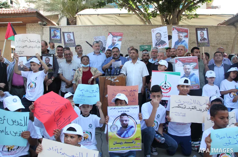 Palestinians take part in a protest to show solidarity with prisoners held in Israeli jails, in front of Red cross office in Gaza city, on July 18, 2022. According to the latest figures from Addameer, the Palestinian Pri...