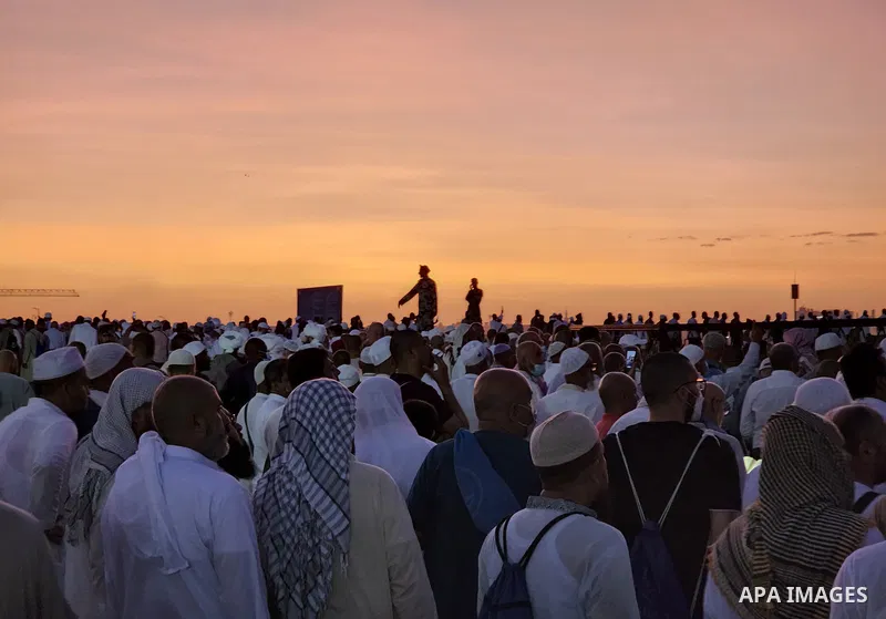 Muslim pilgrims visits Al-Baqi cemetery next to the Prophet Mohammed's mosque and a place of great reverence for Muslims in Saudi Arabia's holy city of Medina, Islam's second holiest city on July 18, 2022. Al-Baqi cemete...