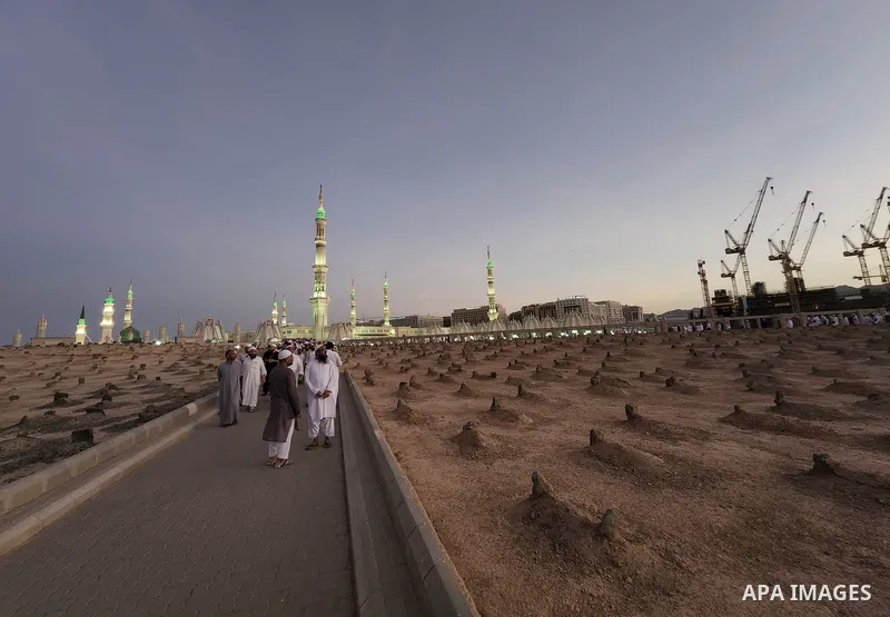 Muslim pilgrims visits Al-Baqi cemetery next to the Prophet Mohammed's mosque and a place of great reverence for Muslims in Saudi Arabia's holy city of Medina, Islam's second holiest city on July 18, 2022. Al-Baqi cemete...