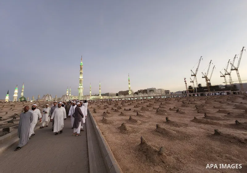 Muslim pilgrims visits Al-Baqi cemetery next to the Prophet Mohammed's mosque and a place of great reverence for Muslims in Saudi Arabia's holy city of Medina, Islam's second holiest city on July 18, 2022. Al-Baqi cemete...