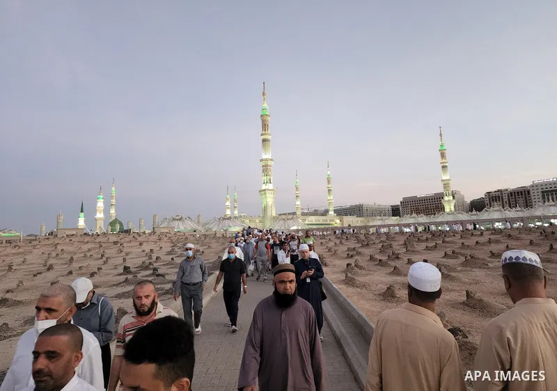 Muslim pilgrims visits Al-Baqi cemetery next to the Prophet Mohammed's mosque and a place of great reverence for Muslims in Saudi Arabia's holy city of Medina, Islam's second holiest city on July 18, 2022. Al-Baqi cemete...
