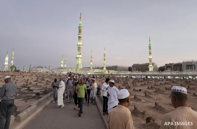 Muslim pilgrims visits Al-Baqi cemetery next to the Prophet Mohammed's mosque and a place of great reverence for Muslims in Saudi Arabia's holy city of Medina, Islam's second holiest city on July 18, 2022. Al-Baqi cemete...