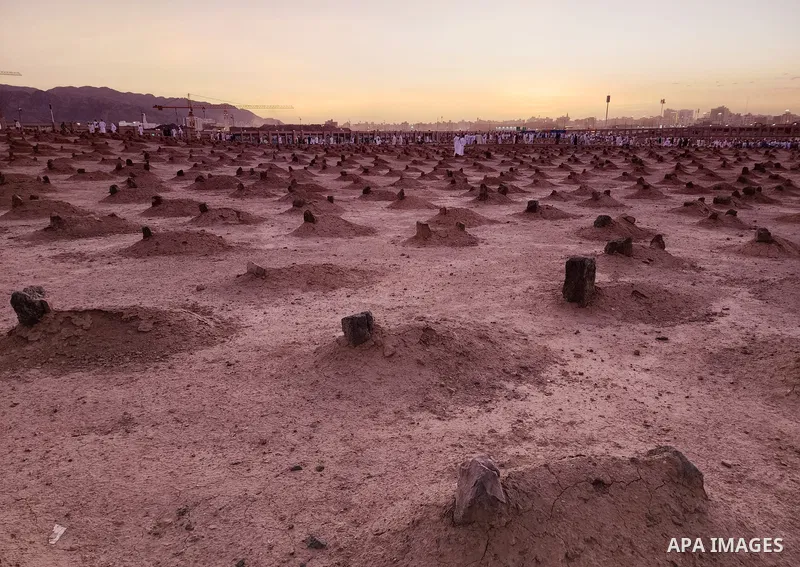 Muslim pilgrims visits Al-Baqi cemetery next to the Prophet Mohammed's mosque and a place of great reverence for Muslims in Saudi Arabia's holy city of Medina, Islam's second holiest city on July 18, 2022. Al-Baqi cemete...