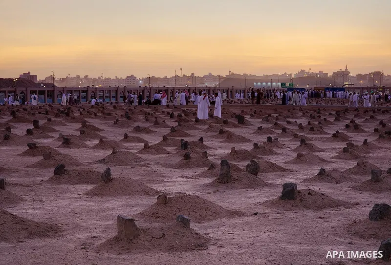 Muslim pilgrims visits Al-Baqi cemetery next to the Prophet Mohammed's mosque and a place of great reverence for Muslims in Saudi Arabia's holy city of Medina, Islam's second holiest city on July 18, 2022. Al-Baqi cemete...