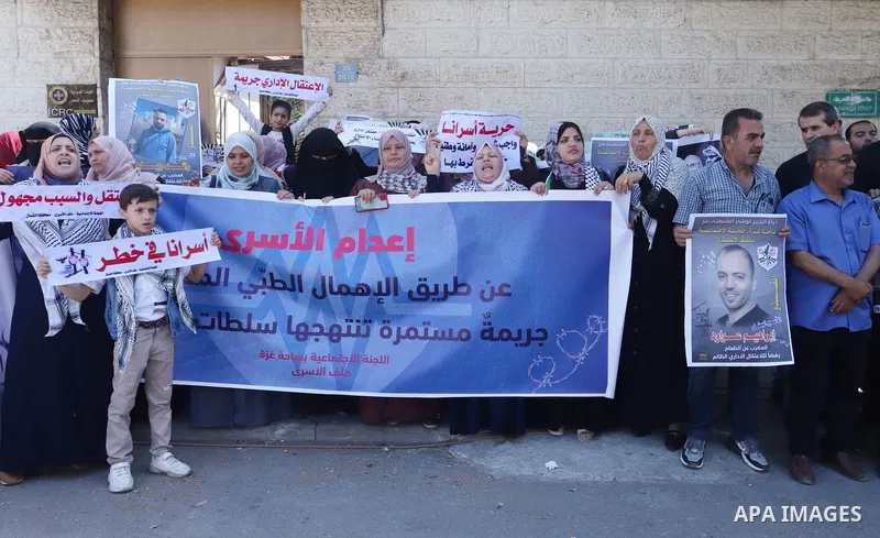 Palestinians take part in a protest in solidarity with prisoners in Israeli Jails in front of Red Cross office in Gaza city on June 6, 2022. The Israeli Prison Service rejected a petition submitted by the attorneys of Pa...