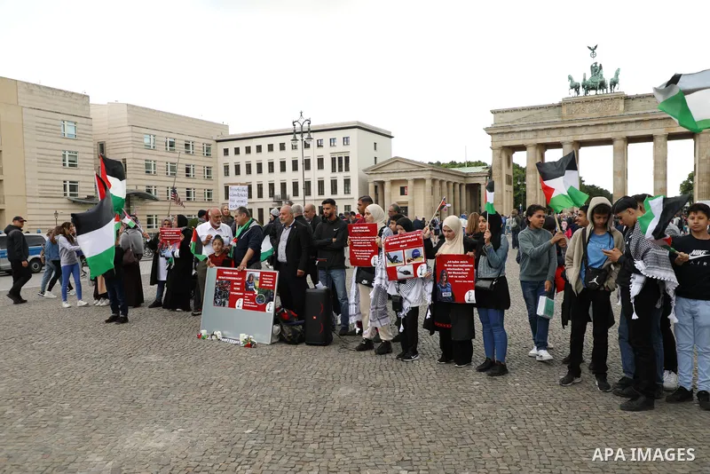 Foreign activists and Palestinians take part in a protest following the death of veteran Al Jazeera journalist Shireen Abu Aqleh, shot dead by Israeli troops as she covered a raid on the West Bank's Jenin refugee campin...