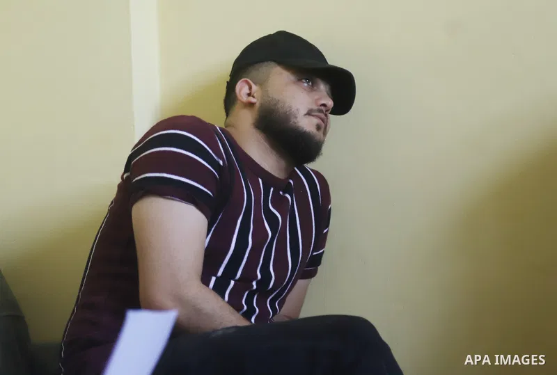 The brother of Ahmed Al-Daya cries at his home, in Gaza city on May 31, 2022. The Father of Ahmed Al-Daya, a haria and Law graduate who left Gaza for Turkey three years ago in search of job opportunities, has appealed to...