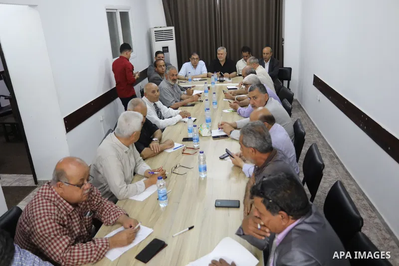 Palestinian members of the national and Islamic forces attend a meeting in Gaza city on May 31, 2022. Photo by Ashraf Amra