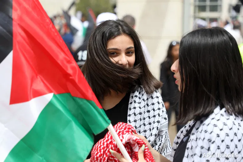 Palestinians wave national flags as they march in a rally marking the 74th anniversary of the "Nakba" or "catastrophe", in the West Bank city of Ramallah, on May 15, 2022. Each year Palestinians commemorate the "Nakba" o...