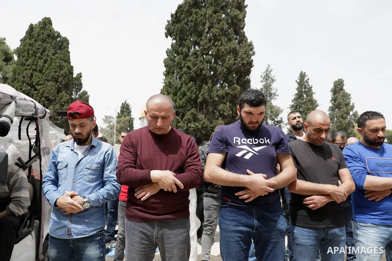 Palestinian Muslim worshippers gather at the Dome of the Rock mosque in the Old City of Jerusalem to attend the first Friday prayer of Ramadan on April 8, 2022. Photo by Jeries Bssier