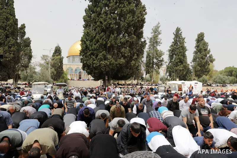 Palestinian Muslim worshippers gather at the Dome of the Rock mosque in the Old City of Jerusalem to attend the first Friday prayer of Ramadan on April 8, 2022. Photo by Jeries Bssier